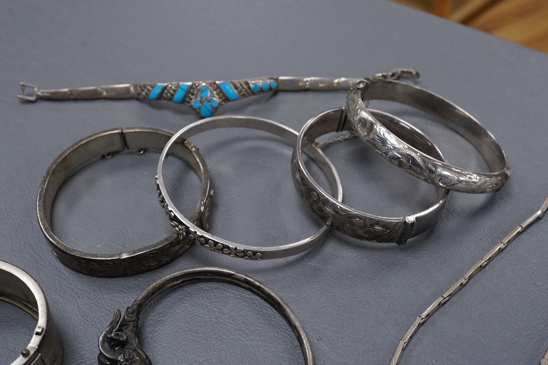 A group of assorted jewellery, including silver and white metal hinged bangles, a 1960's silver mounted cigar cutter by Ramsden & Roed, 925 necklaces and bracelet, etc.